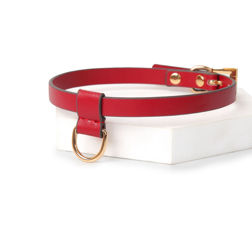 a red leather choker with ring