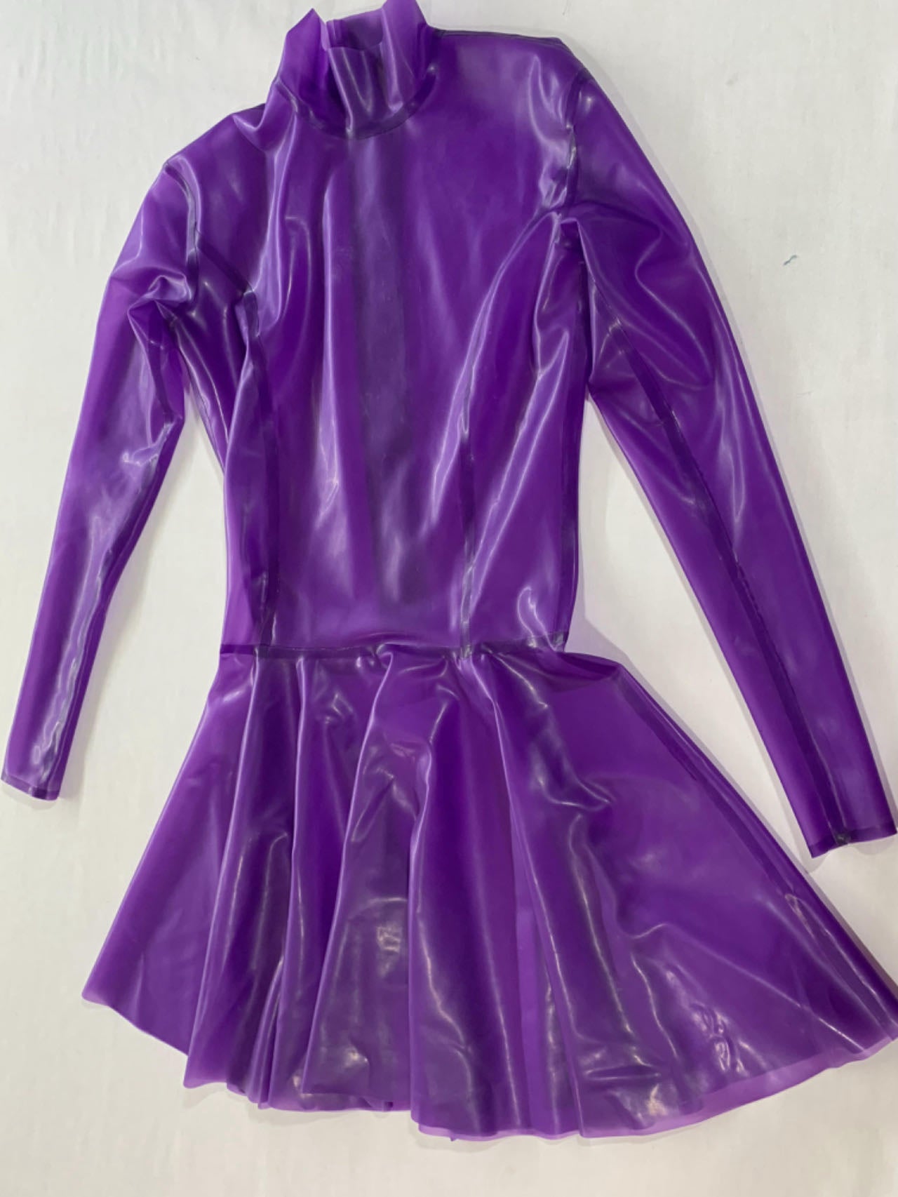 a purple long sleeve latex dress