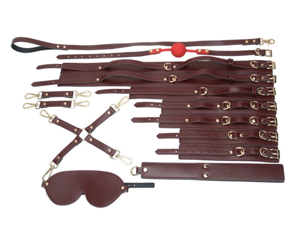 a wine bondage kit with leather handcuffs ankle cuffs thigh cuff collar and leash paddle blindfold ball gag hogtie