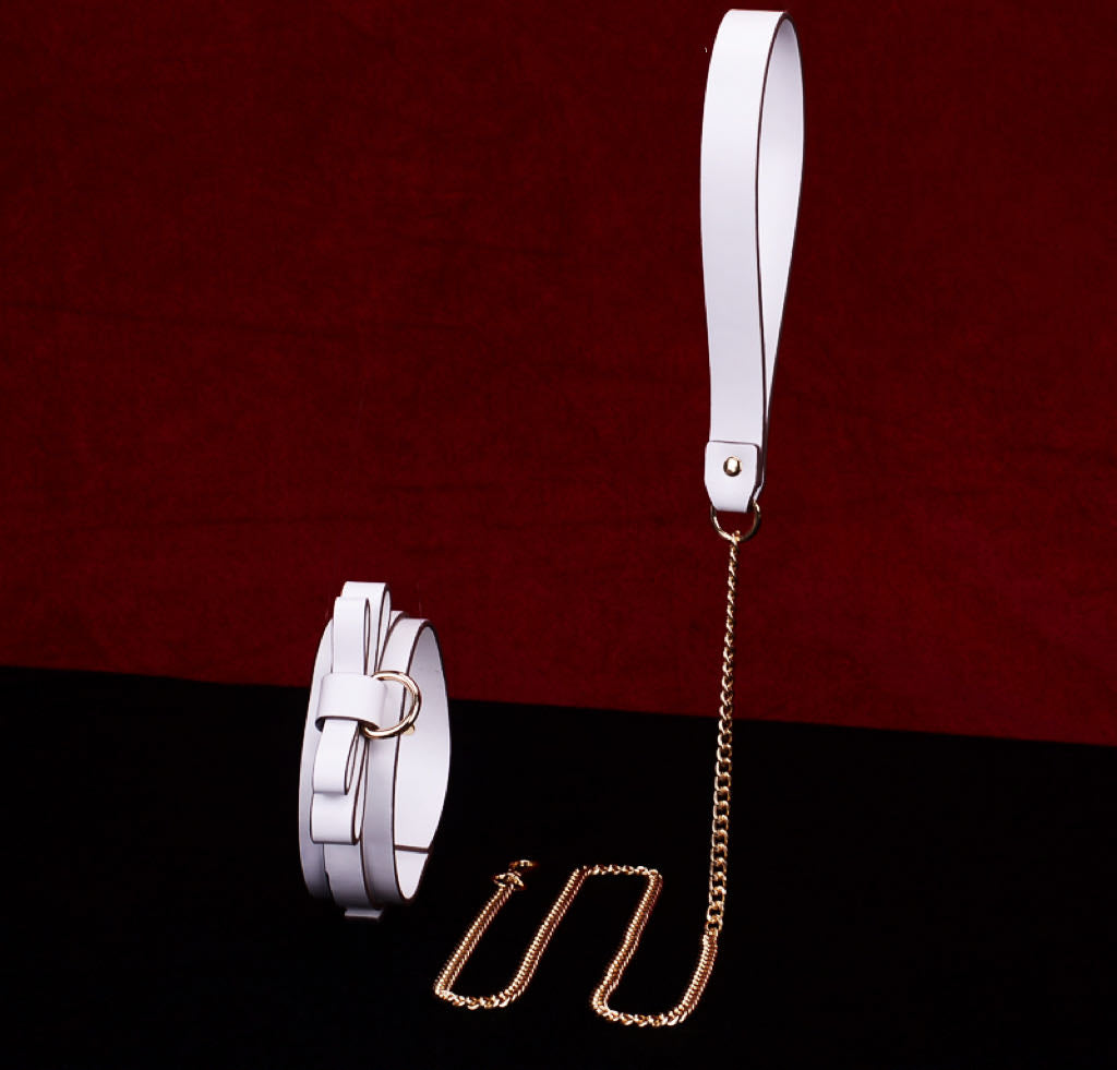 a white bondage collar and leash