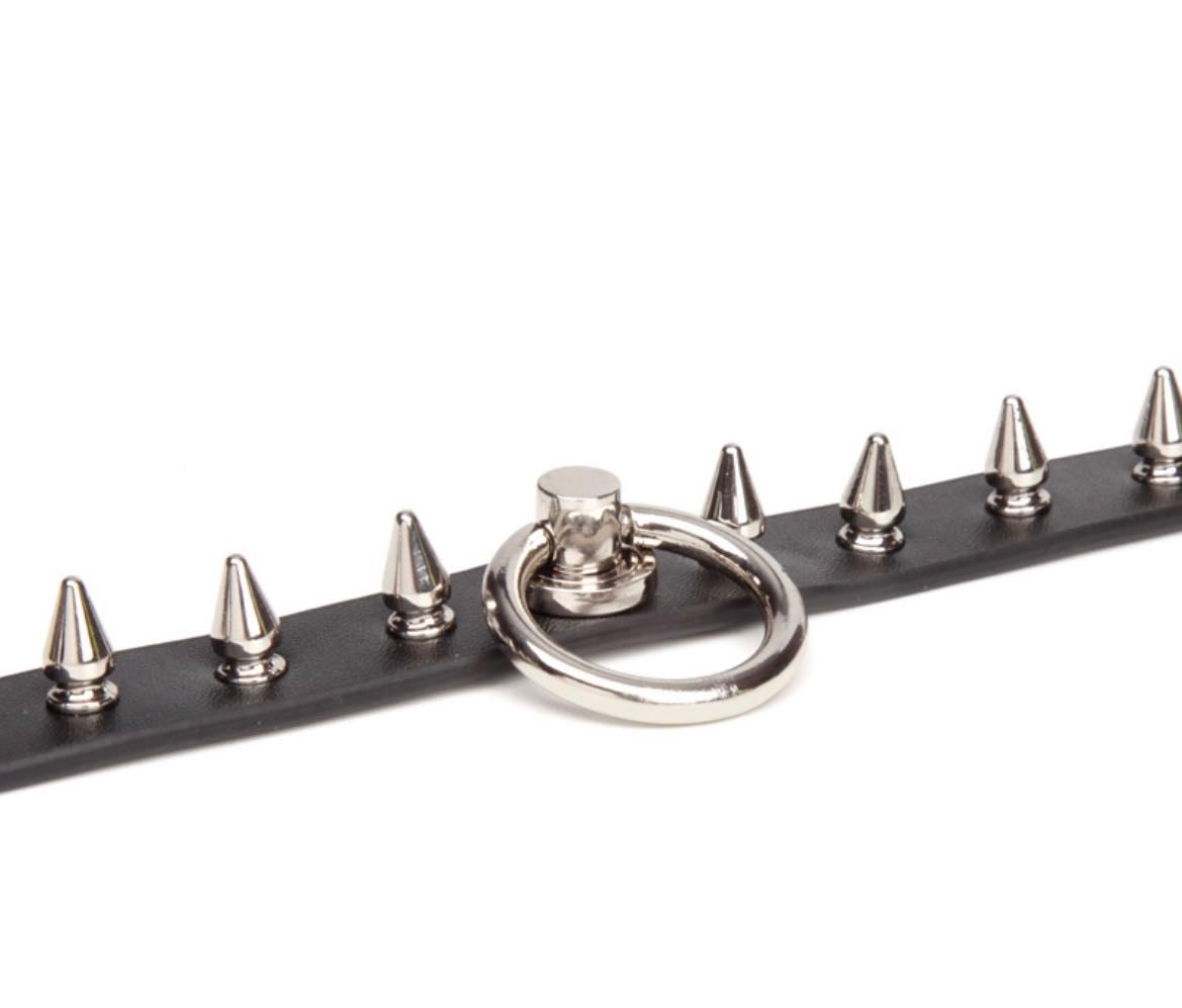 a black spiked choker with ring